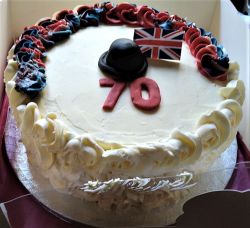 British Club's 70th birthday cake with bowler hat
