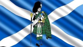 Highland dress on Scottish flag background